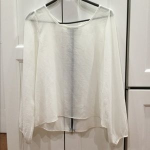 Long sleeved cream blouse